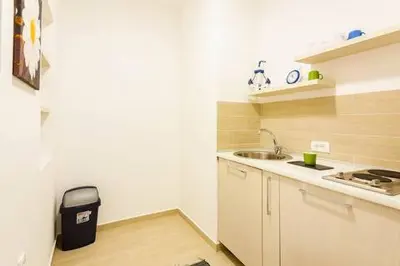 a small kitchen with a sink and a counter at LAReina- Best Buy in Ulcinj