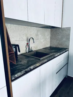 a kitchen with a sink and a counter top at Apartment Comfort A15 in Bar