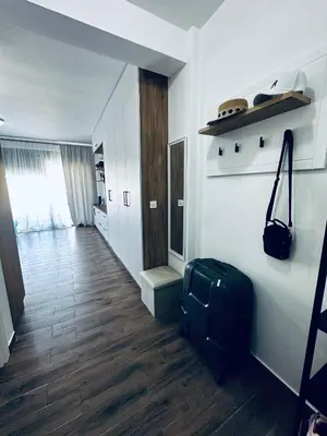 a room with a hallway with a suitcase on the floor at Apartment Comfort A15 in Bar