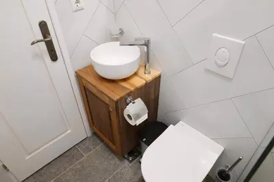 a bathroom with a sink and a toilet at Kotor Lovers in Kotor