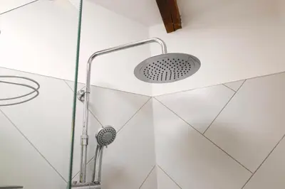 a shower with a shower head in a bathroom at Kotor Lovers in Kotor