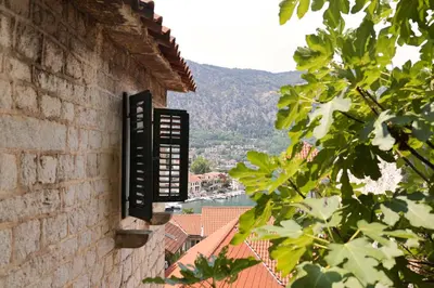 a window on the side of a building with a view at Kotor Lovers in Kotor