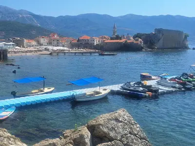 a group of boats in a body of water at Studio Maris in Budva