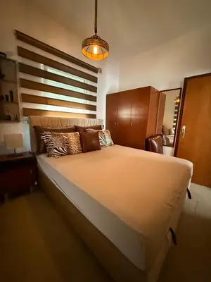a bedroom with a large bed with a large window at Lux Apartman David Dobra voda in Bar