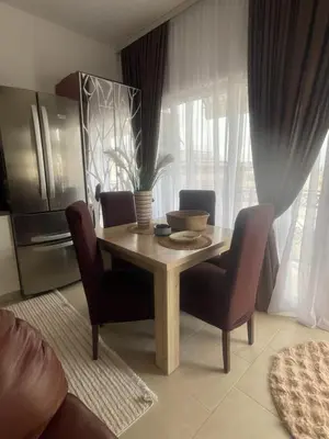 a dining room table and chairs in a kitchen at Lux Apartman David Dobra voda in Bar