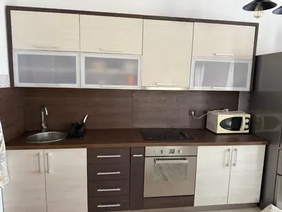 a kitchen with a sink and a microwave in it at Lux Apartman David Dobra voda in Bar