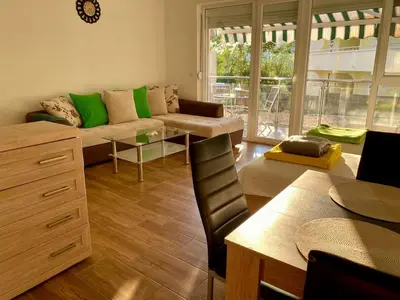 a living room with a couch and a table at Wonder home in Sutomore