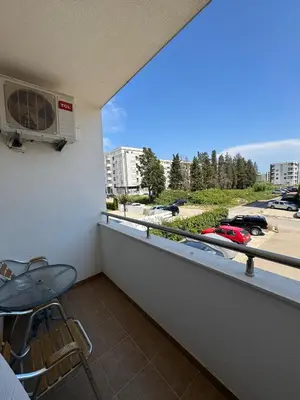 a balcony with a view of a parking lot at Family Comfort Apartment in Ulcinj