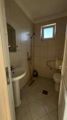 a bathroom with a sink and a toilet at Apparteman donij stoj in Ulcinj