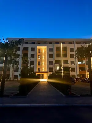 a building with a blue light in front of it at Apartment LM lux in Ulcinj