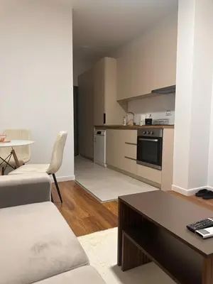 a living room with a couch and a table at Apartment LM lux in Ulcinj