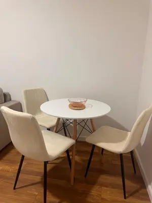 a white table and chairs in a room at Apartment LM lux in Ulcinj