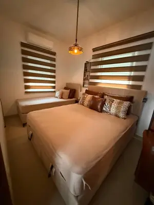 a bedroom with two beds and a couch at Lux apartman David Dobra voda in Bar