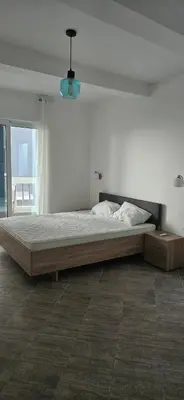 a large bed in a white room with a window at Hotel Kunjui in Utjeha