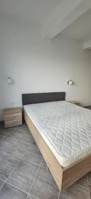 a bedroom with a large bed in a room at Hotel Kunjui in Utjeha
