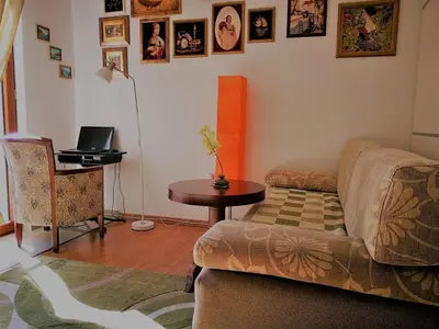 a living room with a couch and a table at Gerbera Budva Montenegro in Budva