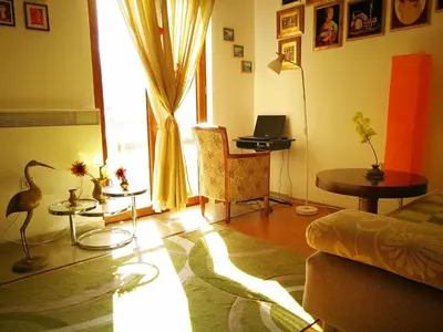 a living room with a bird on the floor at Gerbera Budva Montenegro in Budva