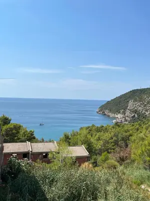 a view of the ocean from a house at Apartmani Jana in Sutomore
