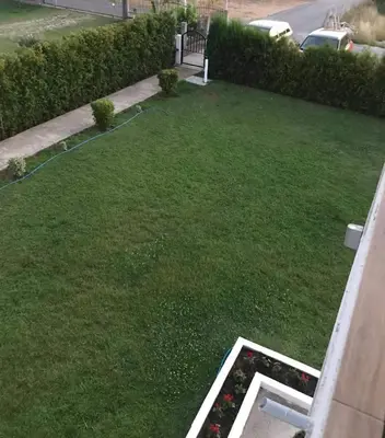an aerial view of a yard with green grass at Konak in Donji Štoj