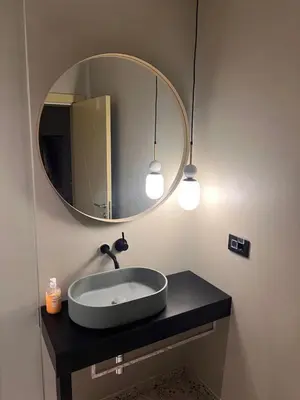 a bathroom with a sink and a mirror at Vila panorama in Budva