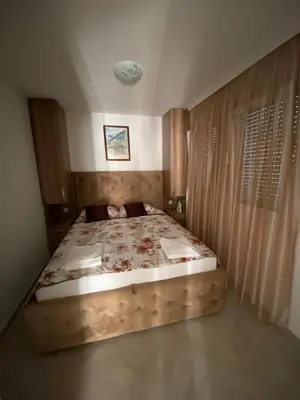 a bedroom with a large bed in a room at Nana Dea 2 in Utjeha