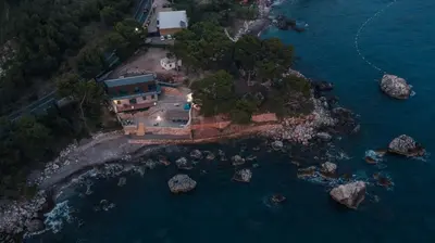an aerial view of a house on a island in the water at Art Residence Holiday Home in Bar