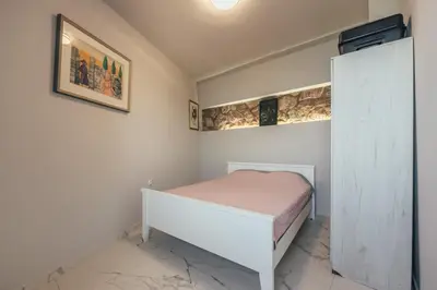 a bedroom with a bed in a room at Art Residence Holiday Home in Bar