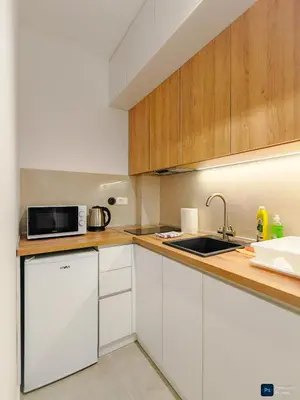 a kitchen with a sink and a microwave at Modern City Apartment Budva 2-Central Location,5 min to Beach in Kravlja