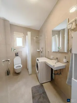 a bathroom with a sink and a toilet and a mirror at Modern City Apartment Budva 2-Central Location,5 min to Beach in Kravlja