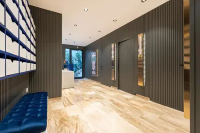 a hallway with a blue bench in a house at Cozy Studio 11 Budvablue with Pool - Parking in Budva