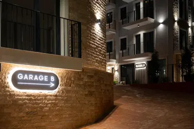 a sign on the side of a brick building at Cozy Studio 11 Budvablue with Pool - Parking in Budva