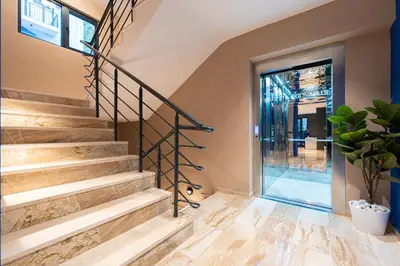 a staircase in a house with a glass door at Cozy Studio 11 Budvablue with Pool - Parking in Budva