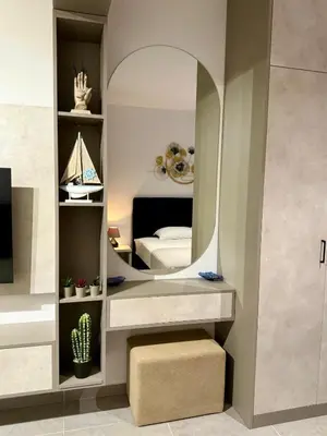 a bedroom with a mirror and a bed at Luxury Studio No3 with Pool and free Parking Budvablue in Budva
