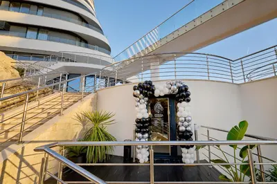 a lobby of a building with a staircase with a entrance at Skyline Sunset in Becici