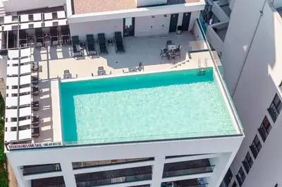 an overhead view of a swimming pool on a building at Hedonist in Ulcinj