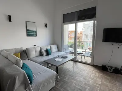 a living room with a couch and a table at Hedonist in Ulcinj