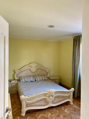 a bedroom with a large bed in a room at Apartman Buki in Bjeliši