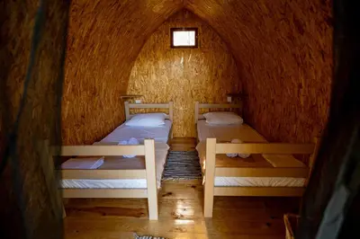 a couple of beds in a small room at Camp River Skadar Lake in Gostilj