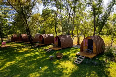 a group of tents sitting in the grass at Camp River Skadar Lake in Gostilj
