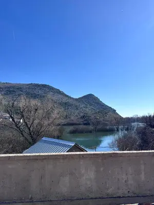 a view of a body of water with a mountain at Stone house Kana-Skadar Lake in Dodoši