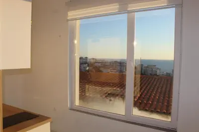 a window with a view of a city at Lunis Dobra Voda in Dobra Voda