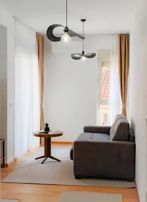 a living room with a couch and a table at Modern City Apartment Budva 4-Central Location,5 min to Beach in Budva