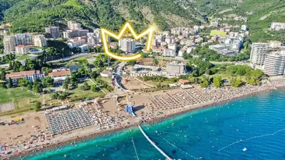 an aerial view of a beach with a large sign at Princess Milena Apartments - Apartment Milena in Becici