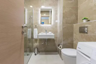 a bathroom with a shower and a sink and a toilet at Princess Milena Apartments - Apartment Milena in Becici