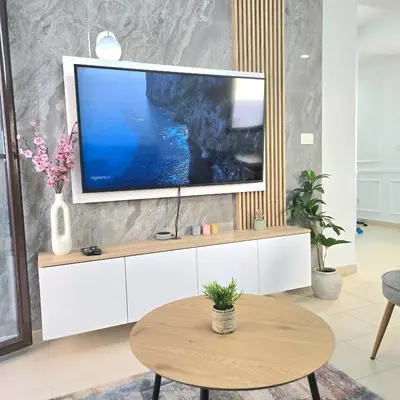 a living room with a tv on a white cabinet at Apartment Nemanja by Princess Milena in Becici
