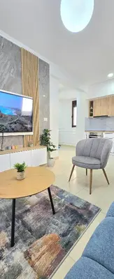 a living room with a couch and a table at Apartment Nemanja by Princess Milena in Becici