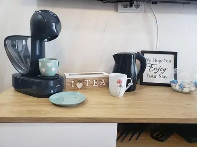 a counter with a coffee maker and cups on it at Princess Milena Apartments - Studio Balsa in Becici