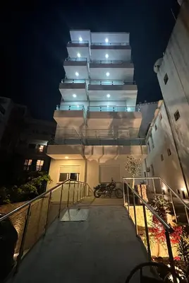 a stairway leading to a building at night at gadina inn in Ulcinj