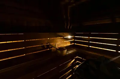 a wooden structure with a light in the dark at Nomio in Tivat