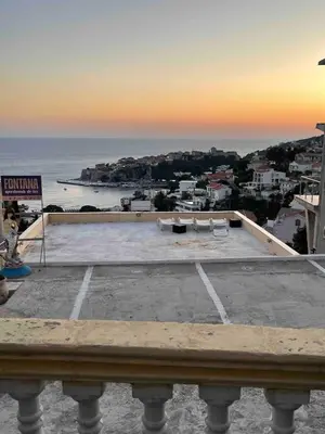 an empty parking lot with a view of the ocean at Fontana Apartments 1A in Ulcinj